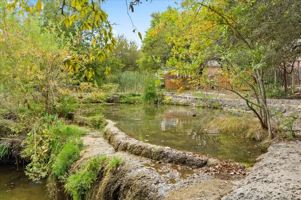 a view of lake with green space