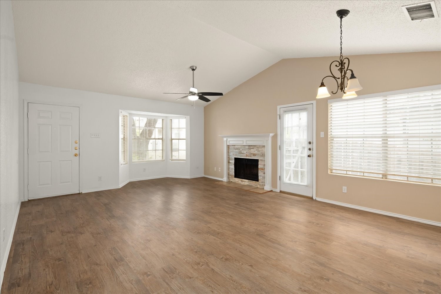 220 Sailmaster Street, Unit A Lakeway, TX 78734 - Photo 7 of 32 a view of empty room with fireplace and windows