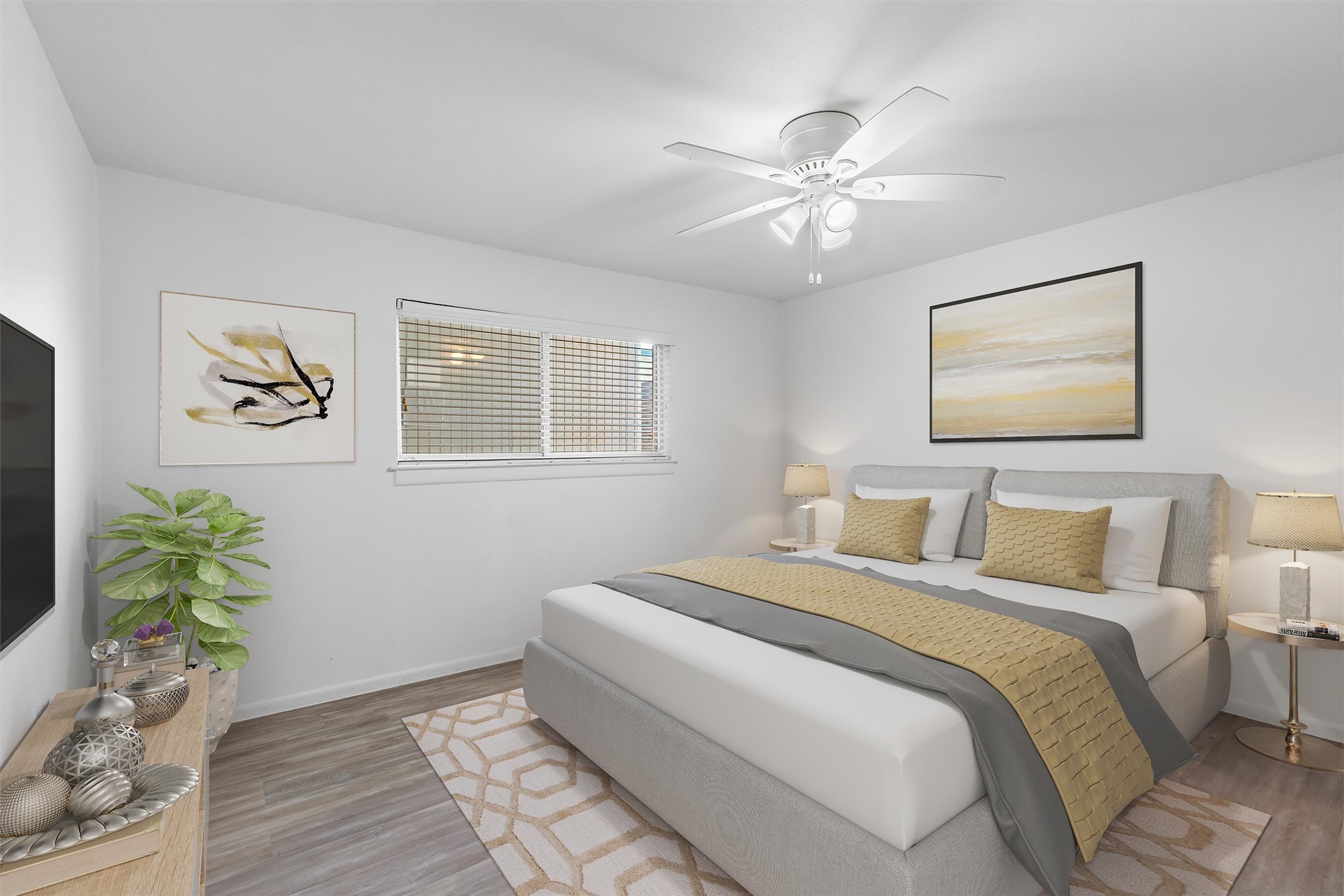 2208 Enfield Road, Unit 10500 Austin, TX 78703 - Photo 18 of 34 Bright room featuring wood-finish flooring and a ceiling fan with integrated lighting