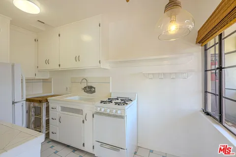 a bathroom with a sink and a washing machine