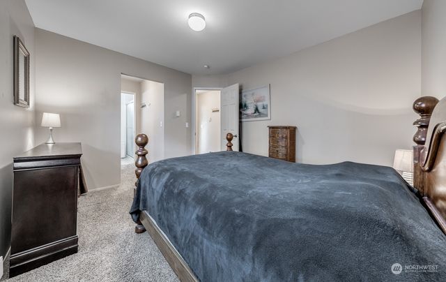a view of a hallway with a dining table