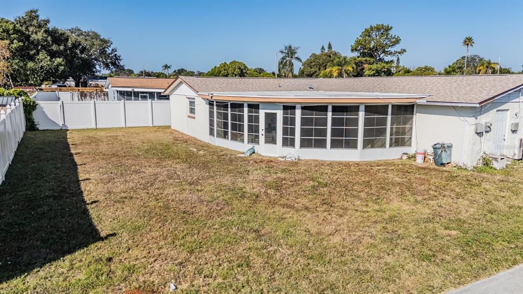 3608 Umber Road Holiday, FL 34691 - Photo 20 of 20 a front view of a house with a yard and garage
