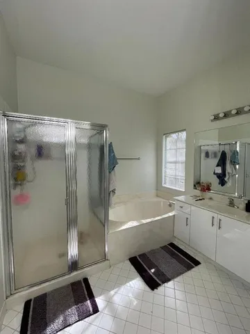 a bathroom with a bathtub and a shower