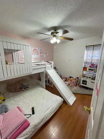 a bedroom with furniture and a chandelier