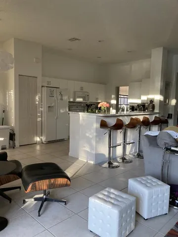 a living room with furniture and a rug