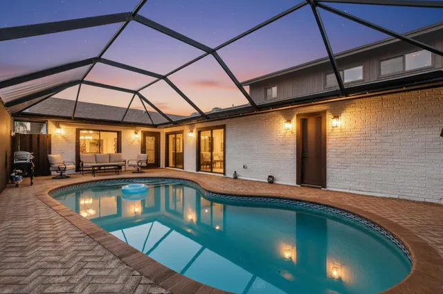 a view of a swimming pool with a patio