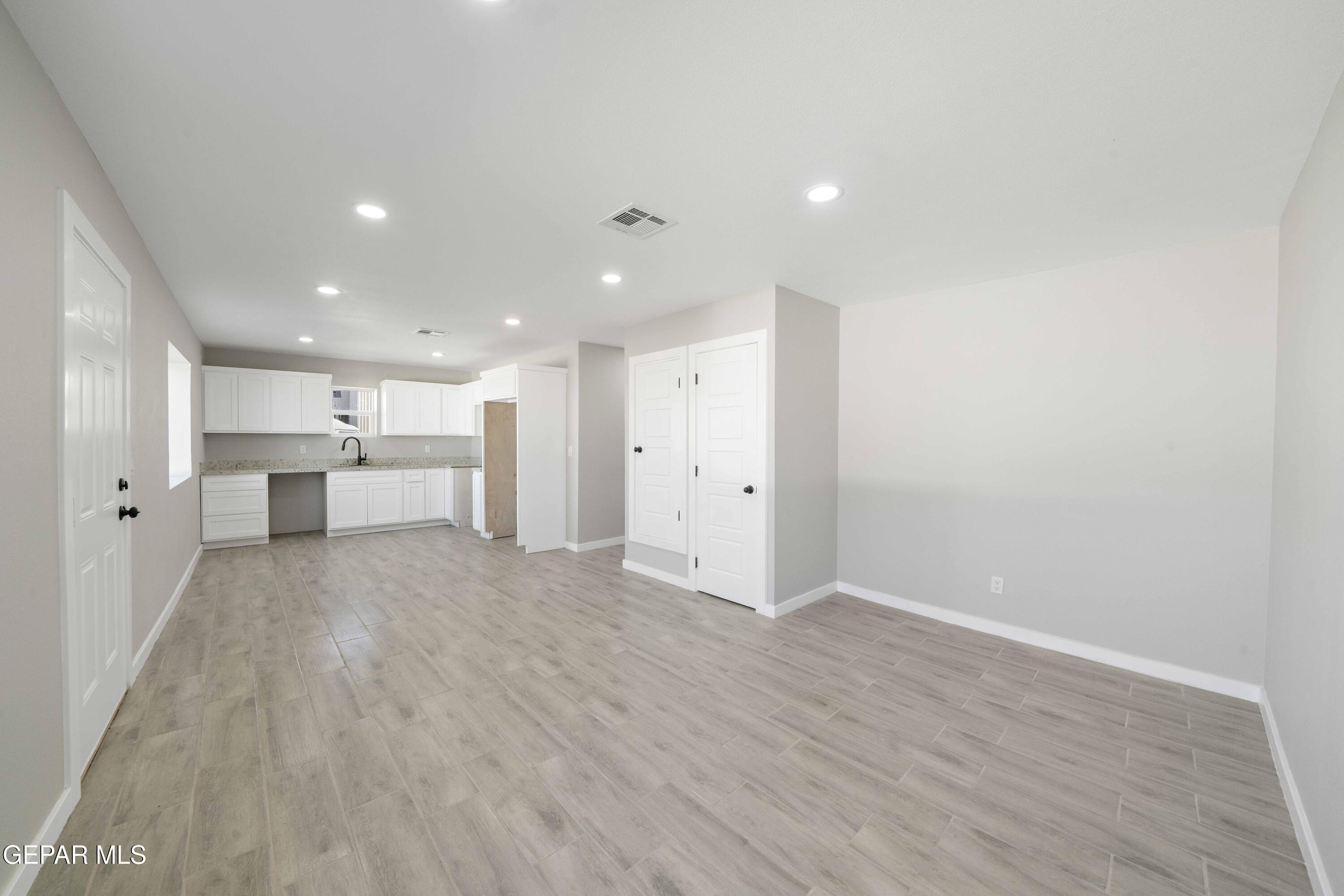 10752 Mellward Road Socorro, TX 79927 - Photo 17 of 37 a view of kitchen with refrigerator and a window