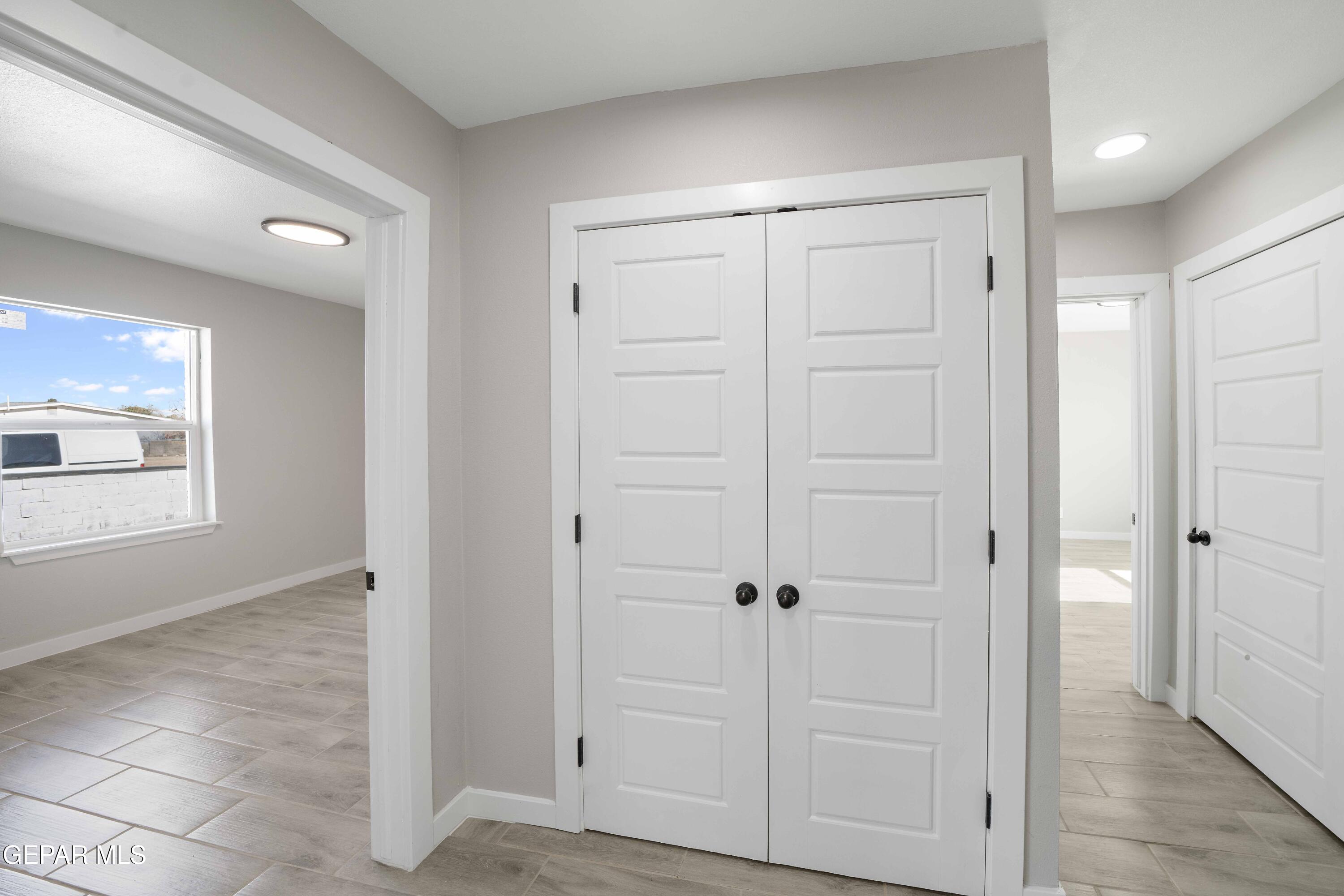 10752 Mellward Road Socorro, TX 79927 - Photo 24 of 37 an empty room with windows and closet