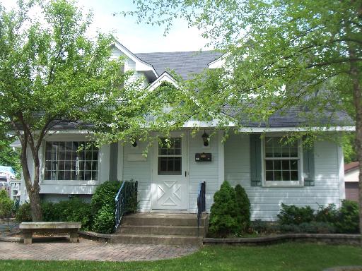 117 Spring Street Cary, IL 60013 - Photo 1 of 1 a front view of a house with a yard and potted plants