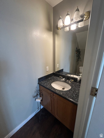 432 Spring Lane Logan, UT 84341 - Photo 14 of 22 Bathroom featuring vanity and dark wood-style flooring