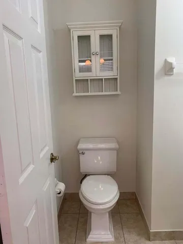 a bathroom with a toilet and a sink