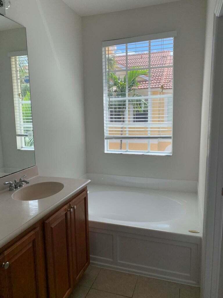 125 Harbors Way Boynton Beach, FL 33435 - Photo 19 of 37 a bathroom with a sink and a window