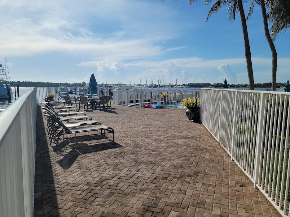 125 Harbors Way Boynton Beach, FL 33435 - Photo 23 of 37 wooden roof deck with outdoor seating and city view