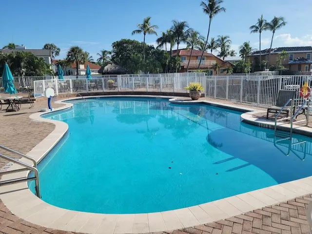 a view of a swimming pool with a patio
