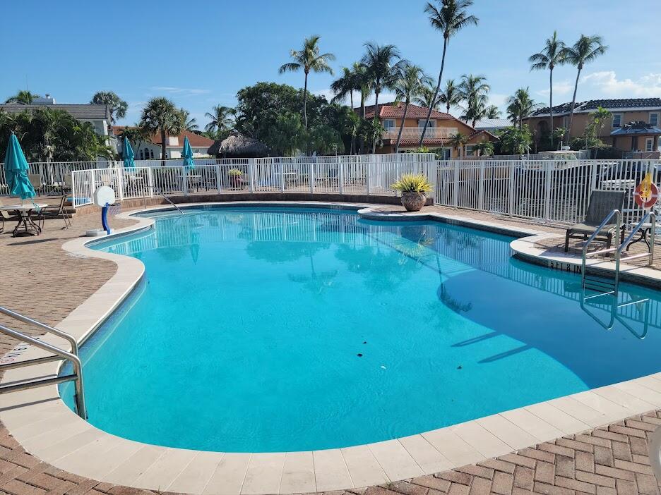 125 Harbors Way Boynton Beach, FL 33435 - Photo 25 of 37 a view of a swimming pool with a patio