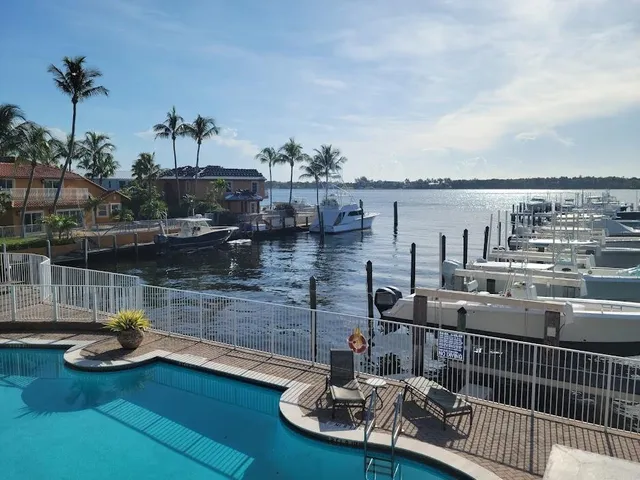a terrace with outdoor seating and lake view