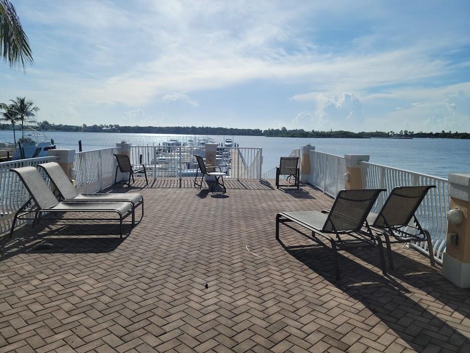 125 Harbors Way Boynton Beach, FL 33435 - Photo 33 of 37 an outdoor sitting area with furniture and lake view