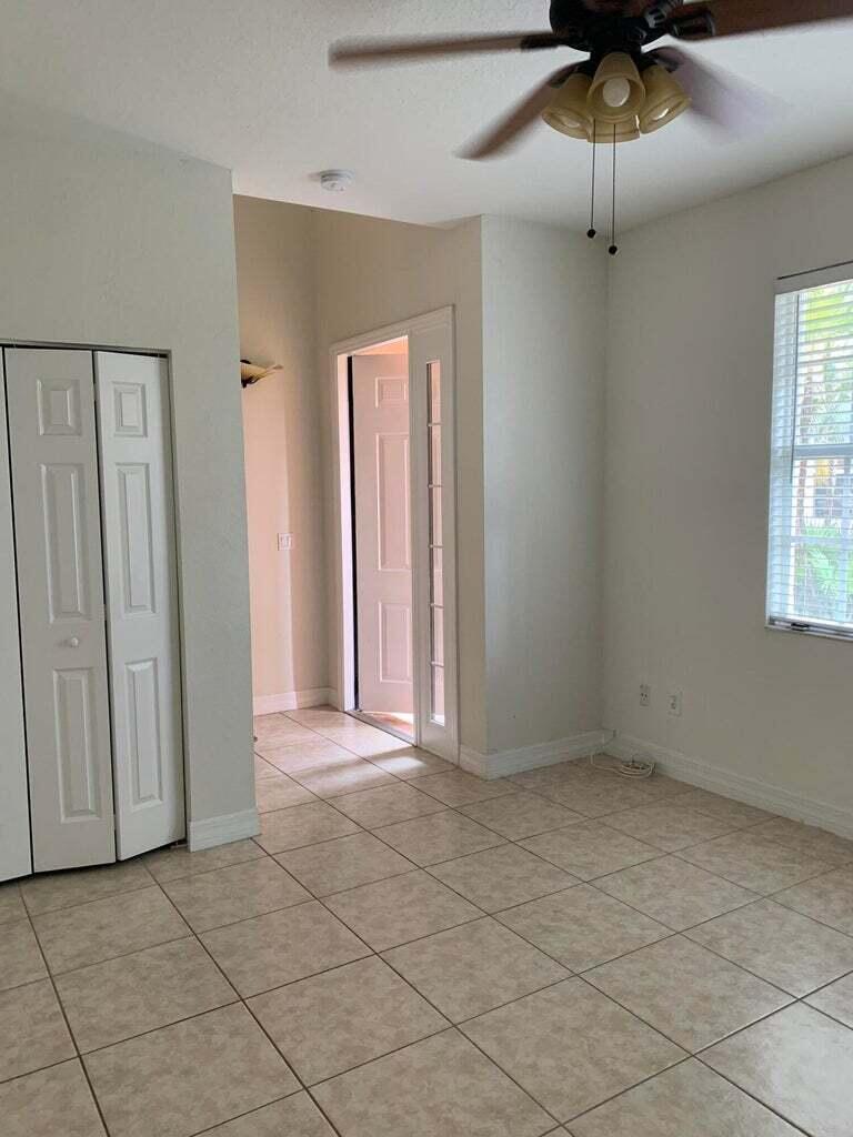 125 Harbors Way Boynton Beach, FL 33435 - Photo 5 of 37 an empty room with fan and windows