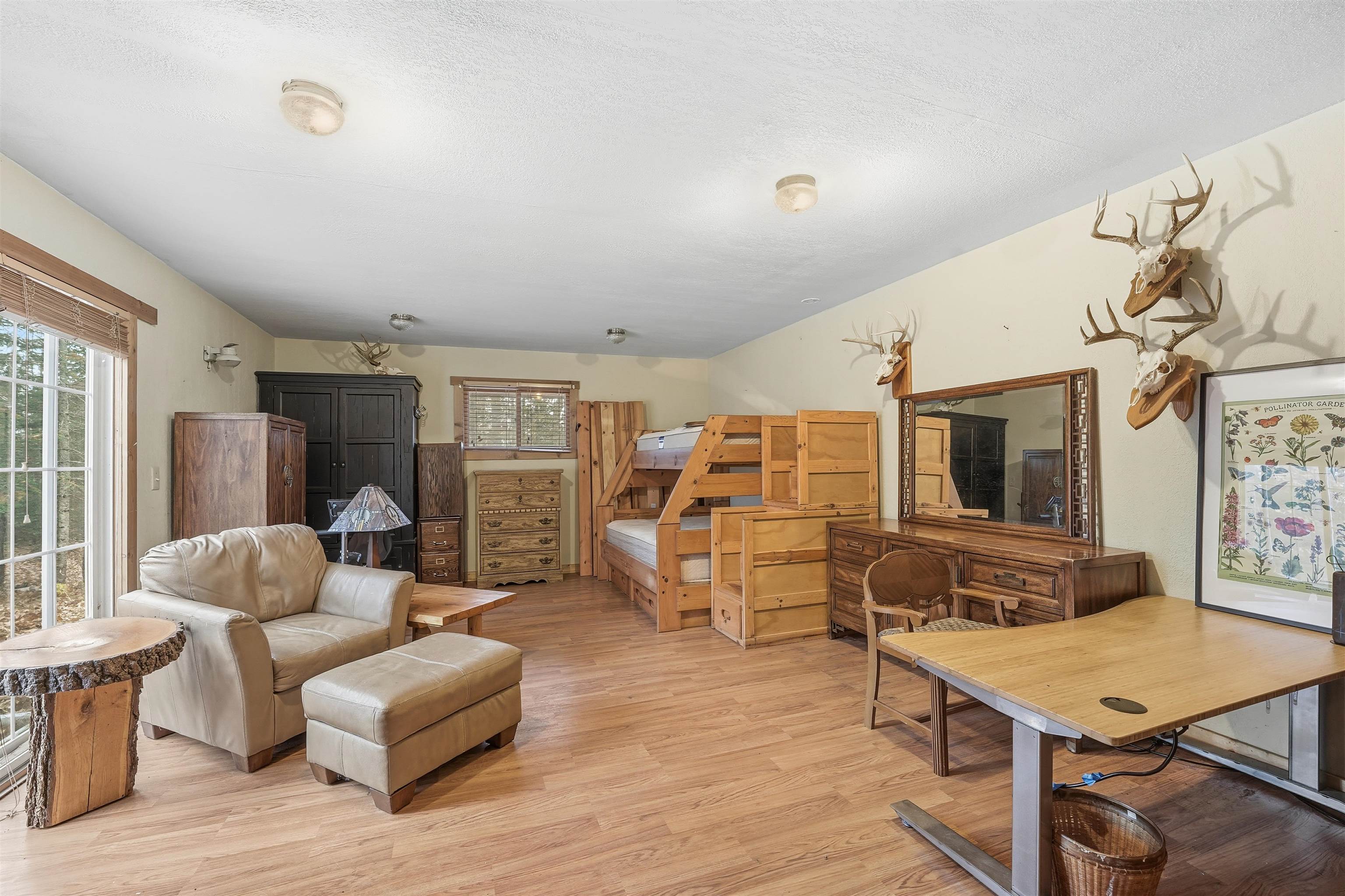 85255 Ravine Road Port Wing, WI 54865 - Photo 20 of 38 Living area with light wood-style floors and a textured ceiling