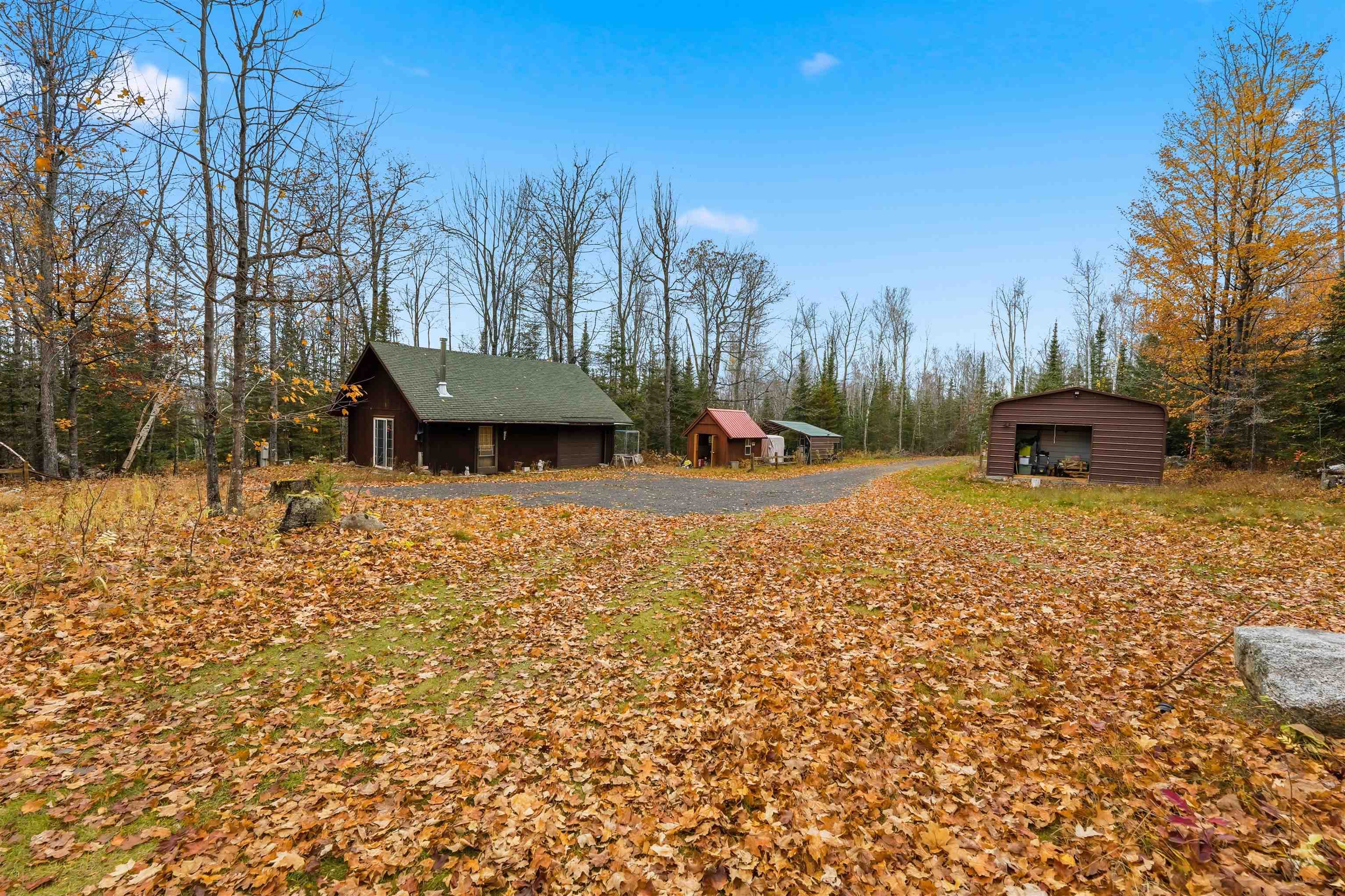 85255 Ravine Road Port Wing, WI 54865 - Photo 24 of 38 View of side of home featuring an outbuilding and a detached garage