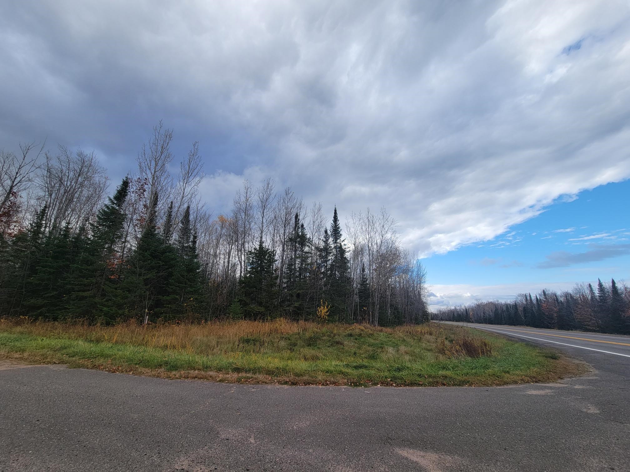 85255 Ravine Road Port Wing, WI 54865 - Photo 31 of 38 View of asphalt road featuring a wooded view