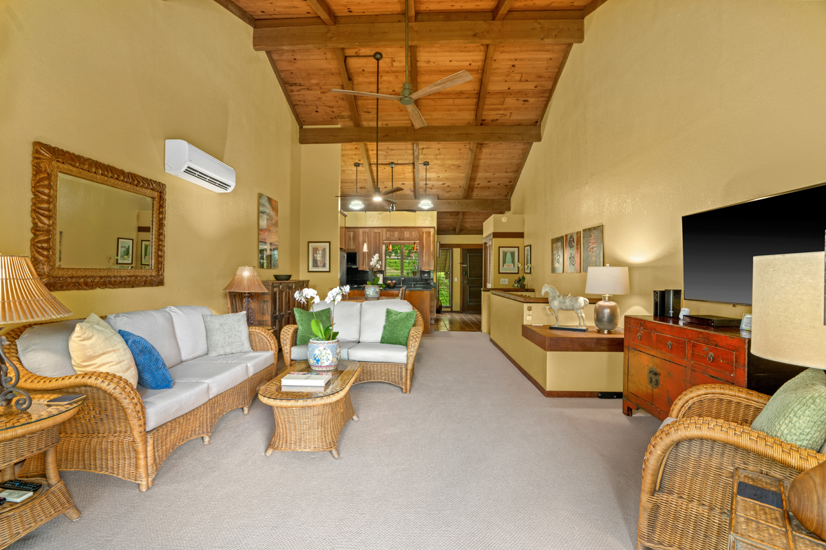 1870 Hoone Road, Unit 602 Koloa, HI 96756 - Photo 2 of 26 a living room with furniture and a chandelier