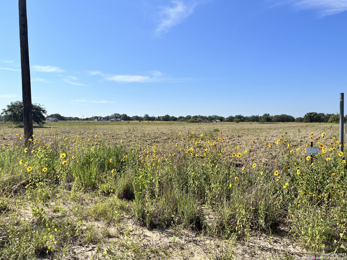 148 Colt Trail Natalia, TX 78059 - Photo 7 of 10 a view of a lake with sunset in background