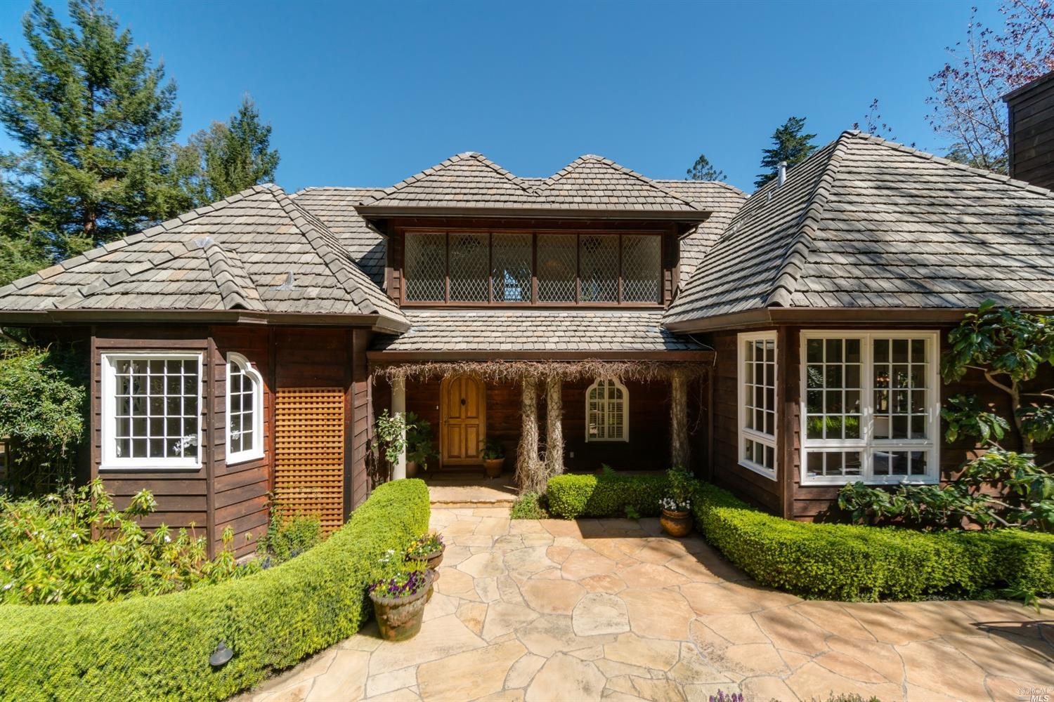 903 Marin Drive Mill Valley, CA 94941 - Photo 1 of 1 a front view of a house with garden
