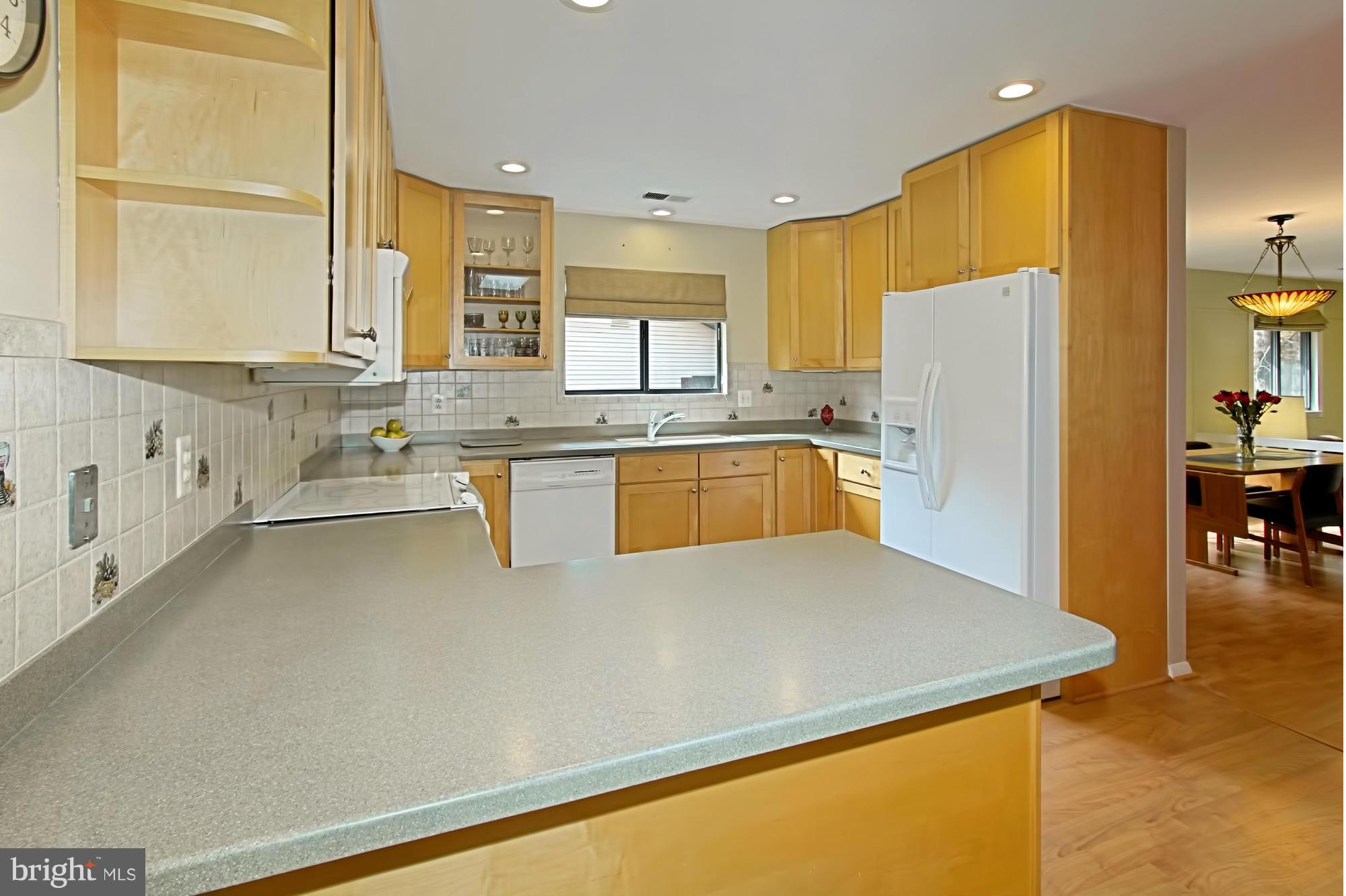 2434 Brussels Court Reston, VA 20191 - Photo 12 of 29 Breakfast Bar with Corian Counter