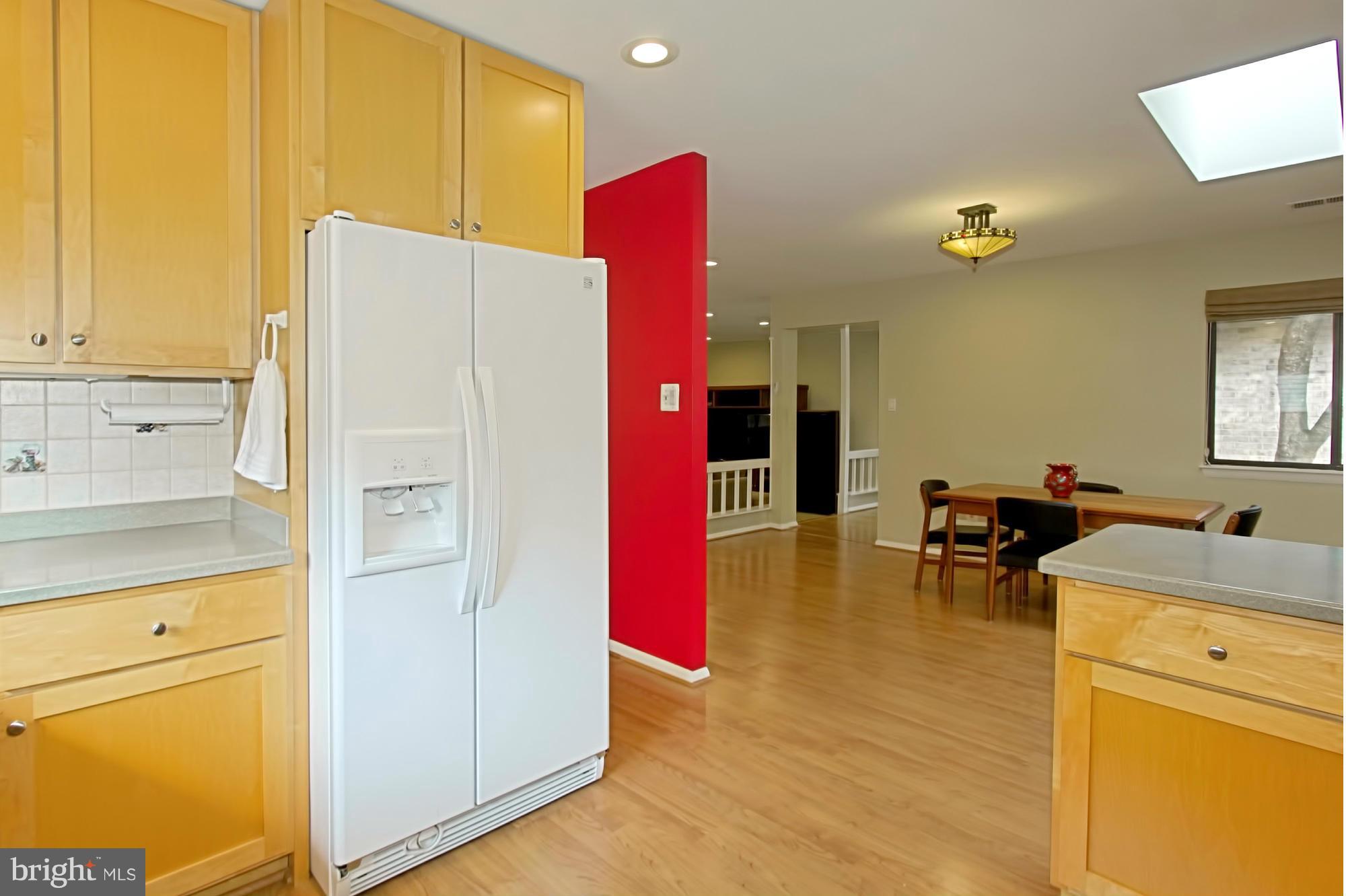 2434 Brussels Court Reston, VA 20191 - Photo 13 of 29 Light-Filled Kitchen Blends into Breakfast Rm