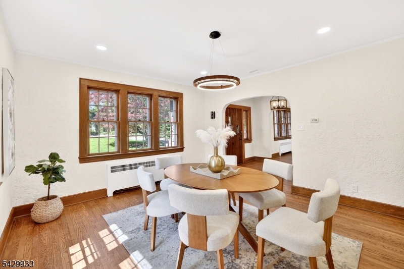184 Old Short Hills Road Short Hills, NJ 07078 - Photo 12 of 46 a dining room with furniture and wooden floor