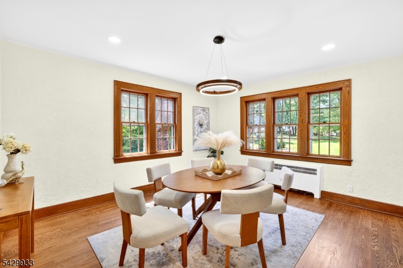 184 Old Short Hills Road Short Hills, NJ 07078 - Photo 13 of 46 a view of a dining room with furniture wooden floor and a window