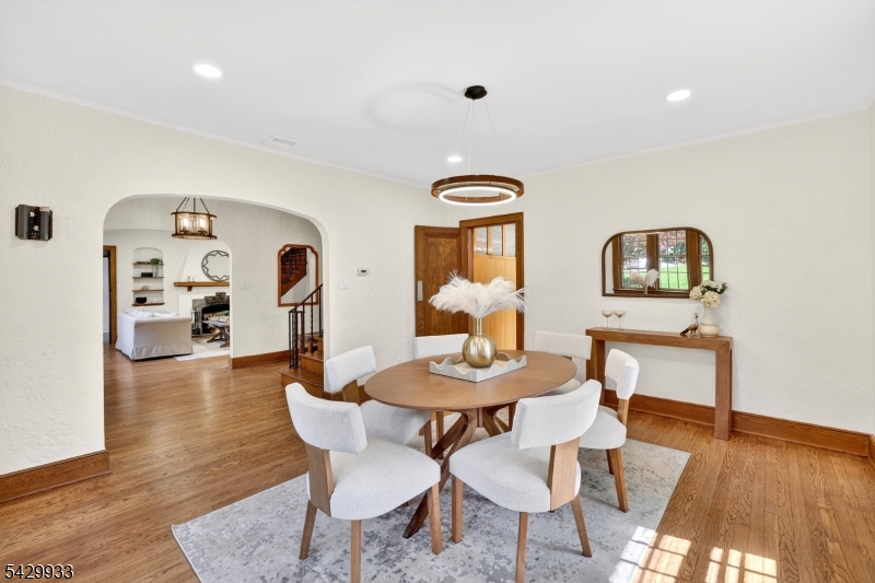 184 Old Short Hills Road Short Hills, NJ 07078 - Photo 14 of 46 a view of a dining room with furniture and wooden floor