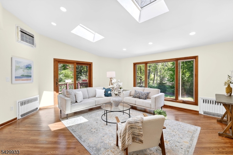 184 Old Short Hills Road Short Hills, NJ 07078 - Photo 17 of 46 a living room with furniture and a large window