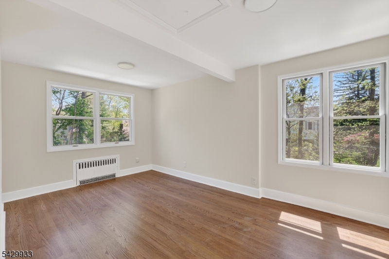 184 Old Short Hills Road Short Hills, NJ 07078 - Photo 29 of 46 an empty room with wooden floor and windows