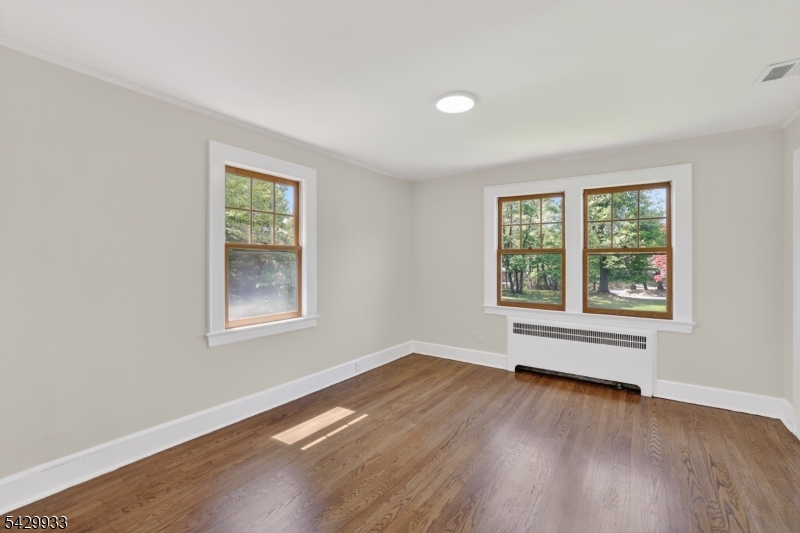 184 Old Short Hills Road Short Hills, NJ 07078 - Photo 30 of 46 a view of an empty room with wooden floor and a window