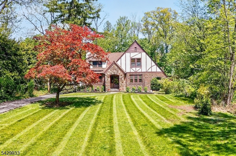 184 Old Short Hills Road Short Hills, NJ 07078 - Photo 3 of 46 a front view of a house with a yard