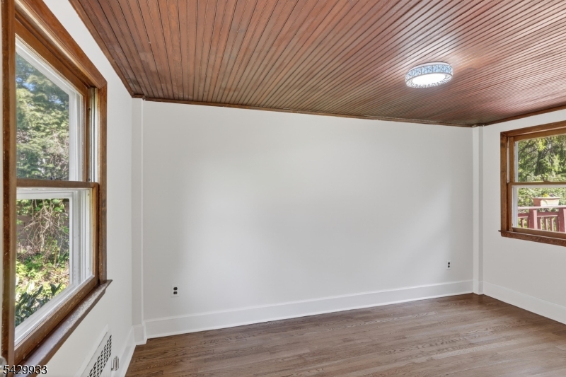 184 Old Short Hills Road Short Hills, NJ 07078 - Photo 31 of 46 an empty room with wooden floor and windows