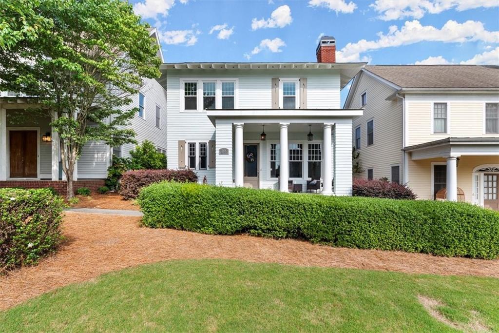 front view of a house with a yard