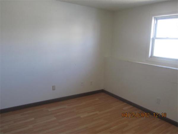 526 Third Street, Unit 2 Fall River, MA 02721 - Photo 2 of 15 an empty room with a window