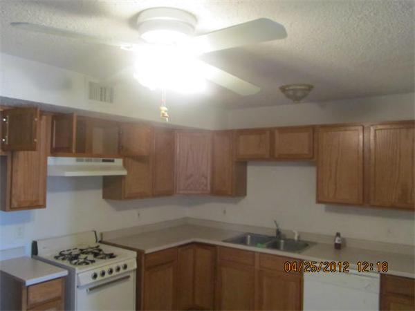 526 Third Street, Unit 2 Fall River, MA 02721 - Photo 5 of 15 a kitchen with stainless steel appliances a sink a stove and cabinets