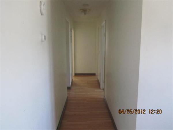 526 Third Street, Unit 2 Fall River, MA 02721 - Photo 8 of 15 a view of a hallway with wooden floor