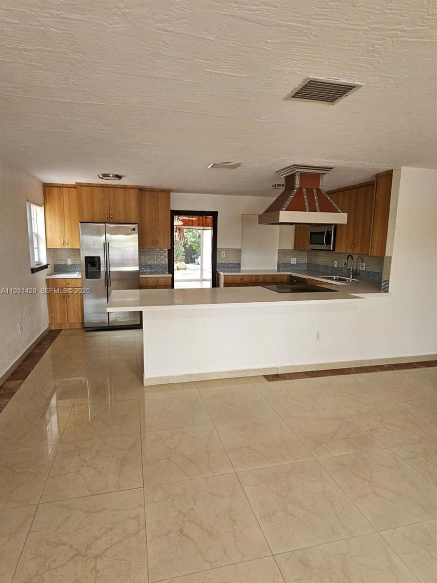 10955 Southwest 56th Street Miami, FL 33165 - Photo 9 of 39 a view of a kitchen with a sink and a large window