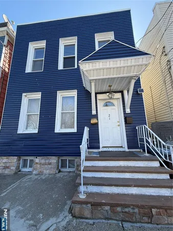 front view of a house with a small yard