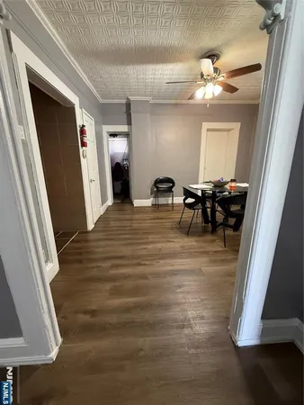 a view of a livingroom with furniture and front door
