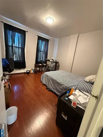 a view of a livingroom with furniture and a flat screen tv