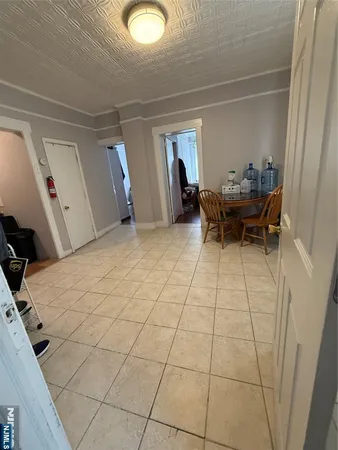 a view of a room with furniture and window