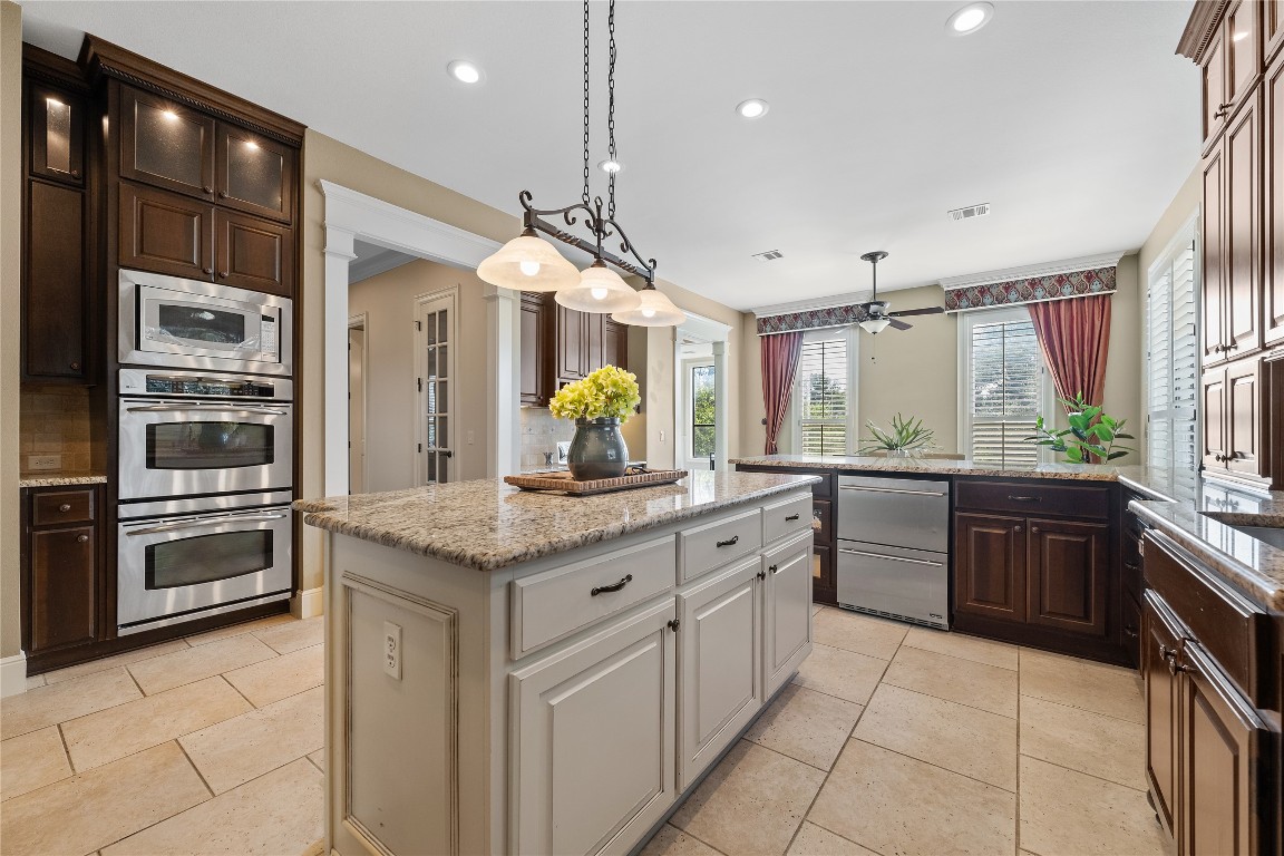 3507 Bachelor Gulch Leander, TX 78641 - Photo 11 of 38 a kitchen with a sink stove and refrigerator