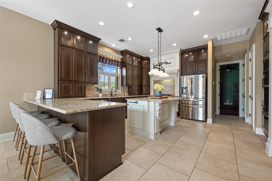 3507 Bachelor Gulch Leander, TX 78641 - Photo 13 of 38 a kitchen with cabinets and counter space