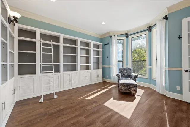 a living room with furniture window and wooden floor